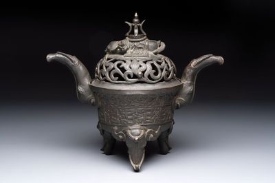 A Chinese bronze 'elephant' tripod censer and cover, Ming