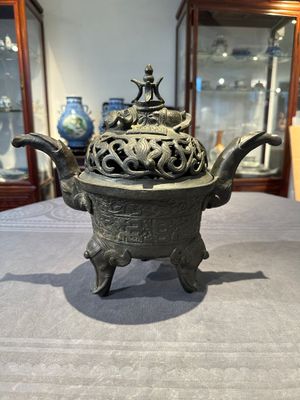 A Chinese bronze 'elephant' tripod censer and cover, Ming — photo 1