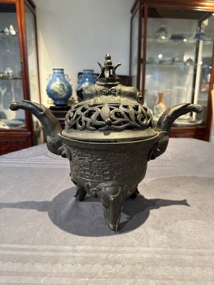 A Chinese bronze 'elephant' tripod censer and cover, Ming — photo 3