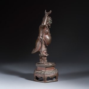 A Chinese bronze figure of a foreigner standing on a pedestal — photo 5