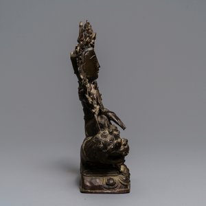 A Chinese bronze figure of Guanyin on a qilin, Ming — photo 4