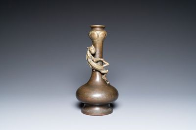 A Chinese bronze garlic-head 'hu' vase, Qianlong mark and probably of the period