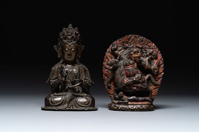 A Chinese bronze Guanyin, Ming and a Tibetan polychrome plaster relief, 19th C.