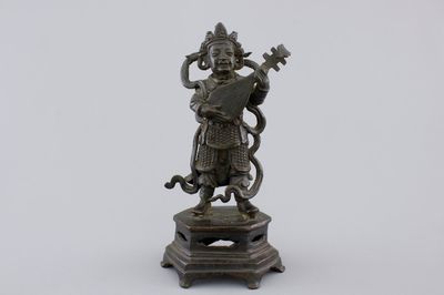 A Chinese bronze sculpture of a musician, Ming Dynasty, 16/17th C.