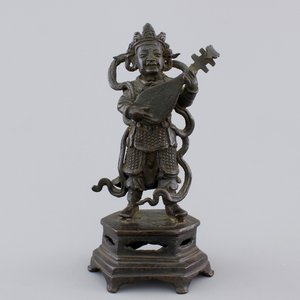A Chinese bronze sculpture of a musician, Ming Dynasty, 16/17th C. — foto 1