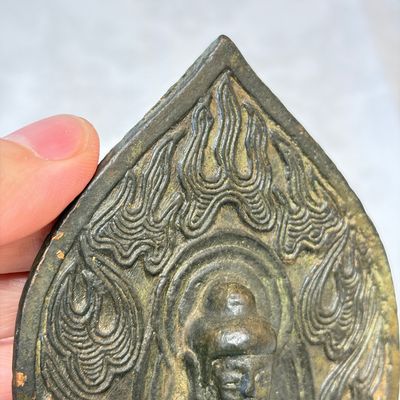 A Chinese bronze seated Buddha with a flaming halo — photo 7