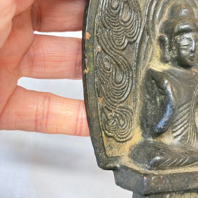 A Chinese bronze seated Buddha with a flaming halo — photo 8