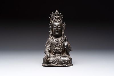 A Chinese bronze seated Guanyin, Ming