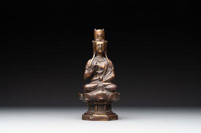 A Chinese bronze seated Guanyin on a lotus throne, probably Liao