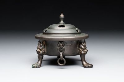 A Chinese bronze tripod censer and cover, Sui/Tang