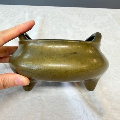 A Chinese bronze tripod censer with handles and stand — photo 10