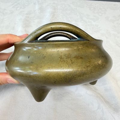 A Chinese bronze tripod censer with handles and stand — photo 11