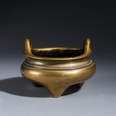 A Chinese bronze tripod censer with handles, Xuande mark, 19th C.