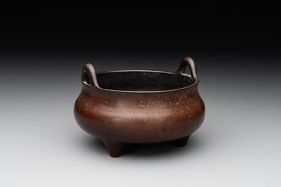 A Chinese bronze tripod censer, Xuande mark, Ming