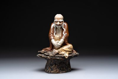 A Chinese brown- and café-au-lait-glazed Luohan, Zeng Longsheng 曾龍升 mark, 20th C.