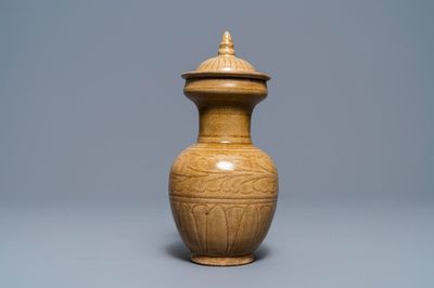 A Chinese brown-glazed vase and cover with incised design, Song