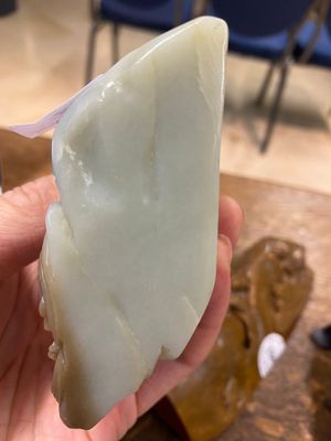 A Chinese brown jade inscribed seal stamp and a white jade 'mountainous landscape' carving, 19/20th C. — photo 18