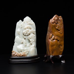 A Chinese brown jade inscribed seal stamp and a white jade 'mountainous landscape' carving, 19/20th C. — photo 1