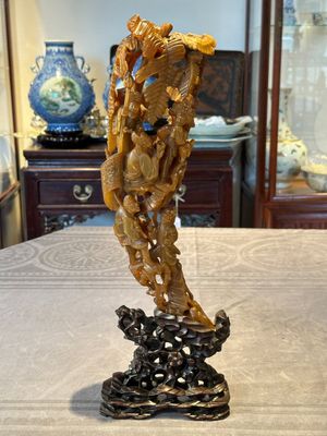 A Chinese buffalo horn carving of a landscape with a pagoda on wooden stand, Qing — photo 1