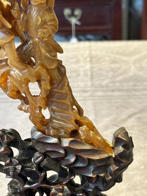 A Chinese buffalo horn carving of a landscape with a pagoda on wooden stand, Qing — photo 6
