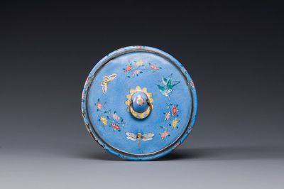 A Chinese Canton enamel blue-ground circular hand mirror, early 19th C.