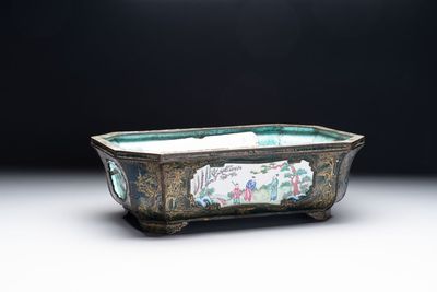 A Chinese Canton enamel gilt-decorated dark-green-ground jardinière with four inserted plaques, Qianlong/Jiaqing