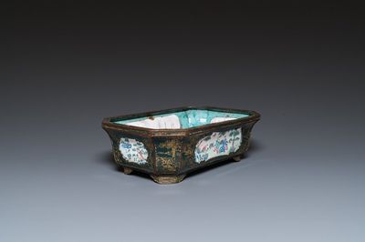 A Chinese Canton enamel gilt-decorated dark-green-ground jardinière with four inserted plaques, Qianlong/Jiaqing