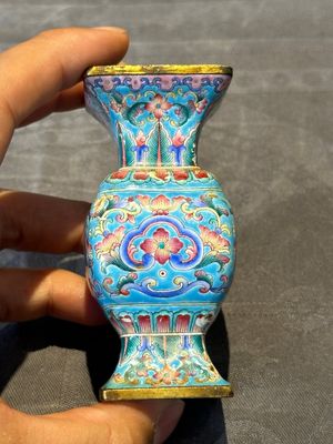 A Chinese Canton enamel 'gu' vase with floral design, Qianlong mark and of the period — photo 1