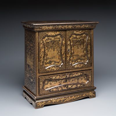 A Chinese Canton gilt-lacquered miniature cabinet on a stand, 19th C.