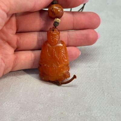 A Chinese carved amber pendant of a Bodhisattva — photo 4