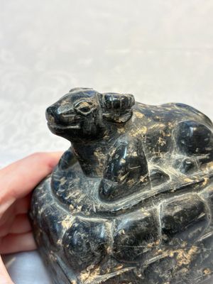 A Chinese carved black stone paper weight in the shape of a reclining buffalo on a lotus throne, Northern and Southern dynasties — photo 8