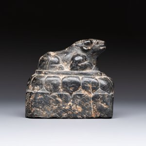 A Chinese carved black stone paper weight in the shape of a reclining buffalo on a lotus throne, Northern and Southern dynasties — photo 2