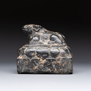A Chinese carved black stone paper weight in the shape of a reclining buffalo on a lotus throne, Northern and Southern dynasties — photo 4