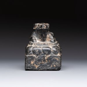 A Chinese carved black stone paper weight in the shape of a reclining buffalo on a lotus throne, Northern and Southern dynasties — photo 5