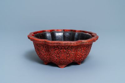 A Chinese carved cinnabar lacquer jardinière, Yongzheng/Qianlong