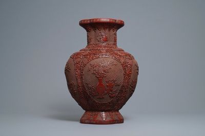 A Chinese carved cinnabar lacquer vase, Qianlong mark, 19/20th C.