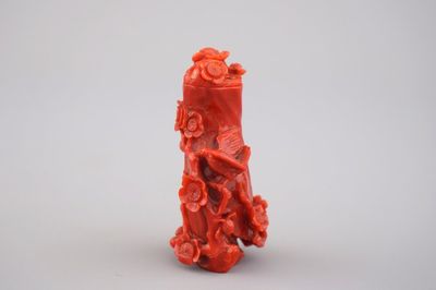 A Chinese carved dark red coral snuff bottle