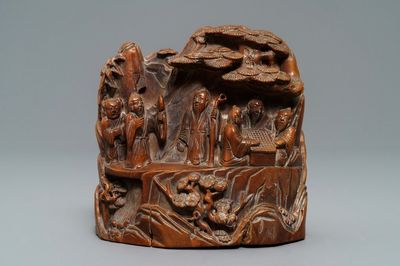 A Chinese carved hardwood group with sages in a garden, 18/19th C.