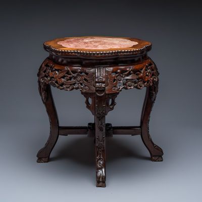 A Chinese carved hongmu marble-top stand, 19th C.