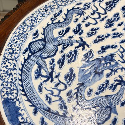 A Chinese carved hongmu table with a blue and white 'Dragons' plaque — photo 4