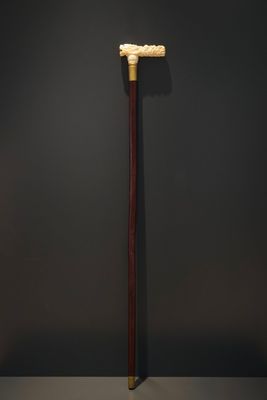 A Chinese carved ivory and wood walking stick or cane with a dragon's head, 19th C.