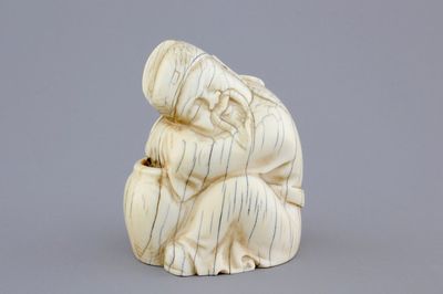 A Chinese carved ivory figure of a sage, signed, 19th C.