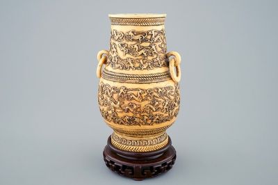 A Chinese carved ivory hu vase on wooden stand, 19th C.