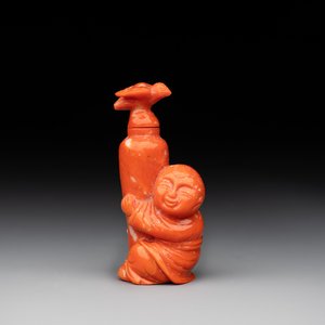 A Chinese carved red coral 'boy and vase' snuff bottle and stopper, 19th C. — photo 1