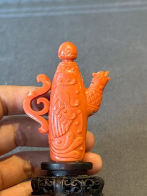 A Chinese carved red coral ewer and cover on wooden stand, 19th C. — photo 2