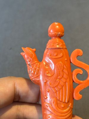 A Chinese carved red coral ewer and cover on wooden stand, 19th C. — photo 4