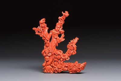 A Chinese carved red coral 'Goddess and Boy' group, 19/20th C.