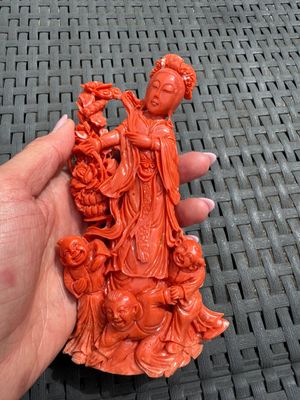 A Chinese carved red coral 'Goddess and Boys' group on a wooden stand, 19/20th C. — photo 2