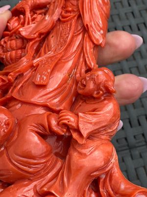 A Chinese carved red coral 'Goddess and Boys' group on a wooden stand, 19/20th C. — photo 7