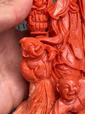 A Chinese carved red coral 'Goddess and Boys' group on a wooden stand, 19/20th C. — photo 8